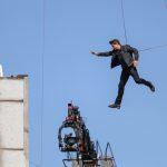 Tom Cruise jumps between two buildings in a scene from the new Mission Impossible film