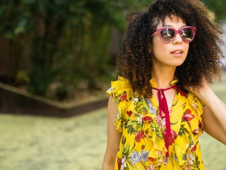 naturally curly hair side part, yellow floral top