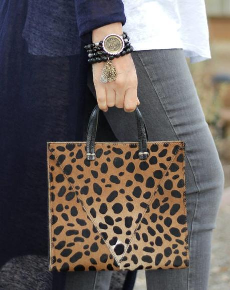 Detail: style blogger Susan B. wears French Kande bracelets and Clare V. leopard tote