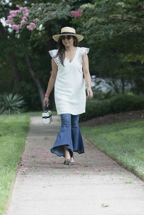 how to wear ruffled jeans, dress over jeans, street style outfit, fashion , j crew ruffle sleeve dress, free people jeans , ruffle hem, starw hat, myriad musings