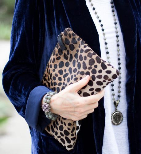 Detail: style blogger Susan B. wears a blue velvet jacket, French Kande jewelry and a Clare V leopard bag.