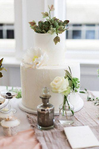 textured wedding cakes white with flowers and herbs with lace texture elizabeth solaru wedding cakes via instagram