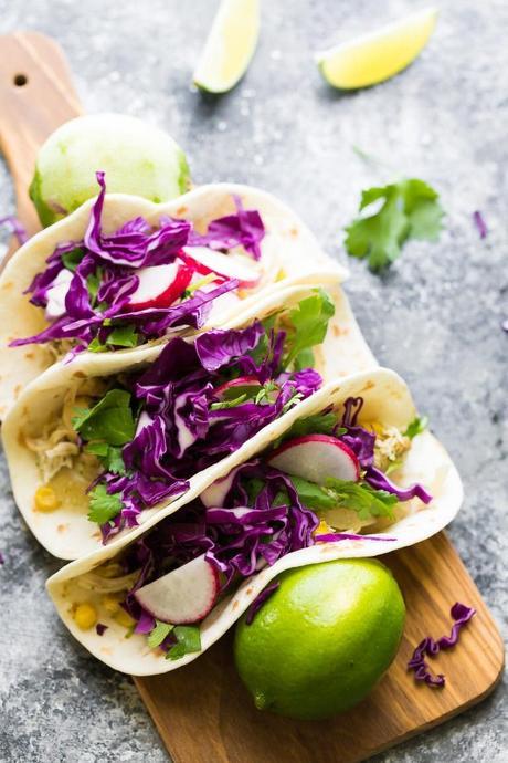 These slow cooker cilantro lime chicken tacos can be assembled ahead and stored in the freezer until you are ready to cook them up.  The cilantro lime chicken is versatile and is also great on salad, in wraps, pizza, you name it!