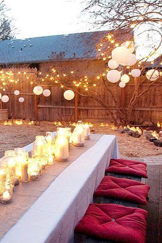 rustic barbecue bbq wedding reception in the courtyard with lights and chinese lanterns tana photography