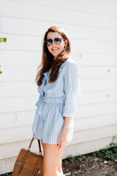 Amy Havins wears a blue and white romper.