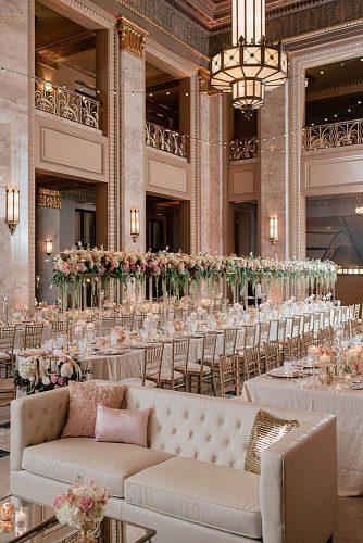 rose gold wedding decor reception in a beautiful room with long tables with tall flower vases mike cassimatis