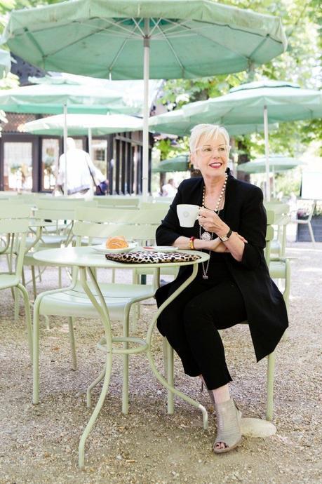 Style blogger Susan B. enjoys a café crème in Jardin du Luxembourg, Paris. Details at une femme d'un certain age.