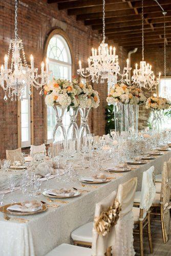loft decorating ideas long table with elegant crockery high vases with flowers and chandeliers tina sargeant via instagram