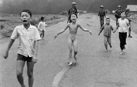 Crying children, including 9-year-old Kim Phuc, center, run down Route 1 near Trang Bang, Vietnam after an aerial napalm attack on suspected Viet Cong hiding places as South Vietnamese forces from the 25th Division walk behind them