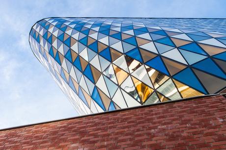 62. Aula Medica, an auditorium complex at Sweden's Karolinska Institute, is an imposing, leaning tower with multi-coloured, triangle panels echoing its flat-iron shape.