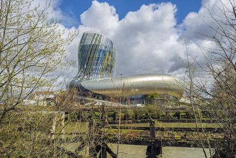 42. The curved structure of wine museum La Cité du Vin, designed by XTU Architects in Bordeaux, France, evokes the shape of a vine, wine glass, and other wine-related motifs.