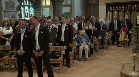 Groom and guests waiting for the bride at St Pauls church in drighlington for the wedding video