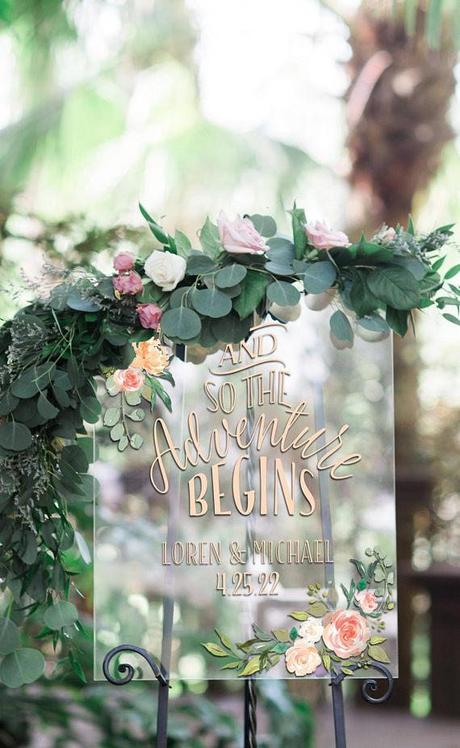 acrylic wedding sign with gold calligraphy and floral garland