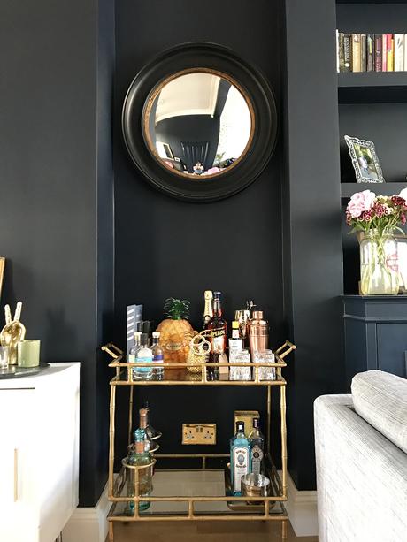 After: Living room transformation. Opulent gold accessories paired with Basalt by Little Greene, for a contemporary and stylish living room.