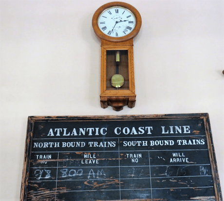 Vintage clock and timetable of the Historic Atlantic Coast