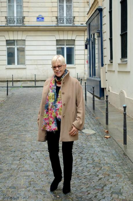 Susan B. wears a camel coat from agnes b. in Paris.