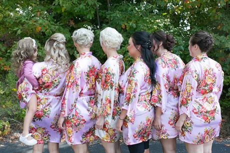 A perfect fall wedding; bridesmaids getting ready for the day in matching robes. 