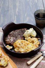 Pork chops with roasted cauliflower parmesan and herb butter