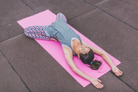 woman streching on a yoga mat
