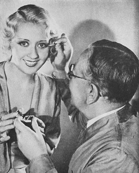 Max-Factor applies eye makeup to Joan Blondell Max-Factor applies eye makeup to Joan Blondell
