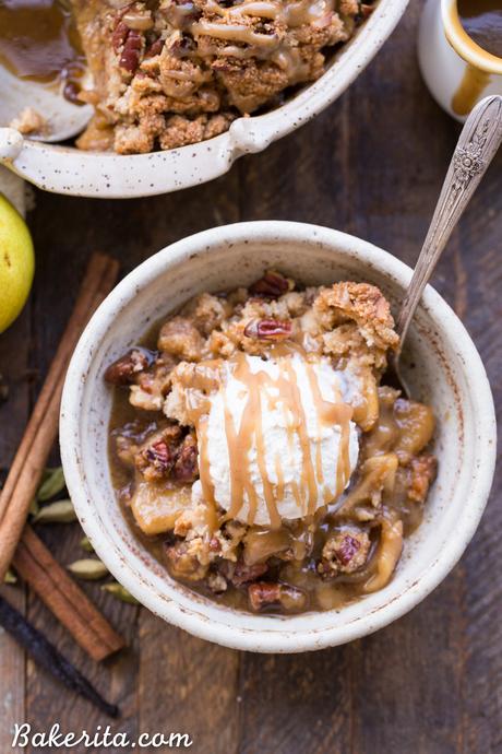 This Caramel Pear Crisp is a decadent and deliciously spiced dessert that's perfect for the holidays. The caramel pear filling is spiced with cinnamon, cardamom, cloves, and vanilla bean, and topped with a crunchy almond flour and pecan crisp topping. Don't forget to serve this gluten-free, paleo, and vegan crisp with some whipped coconut cream!