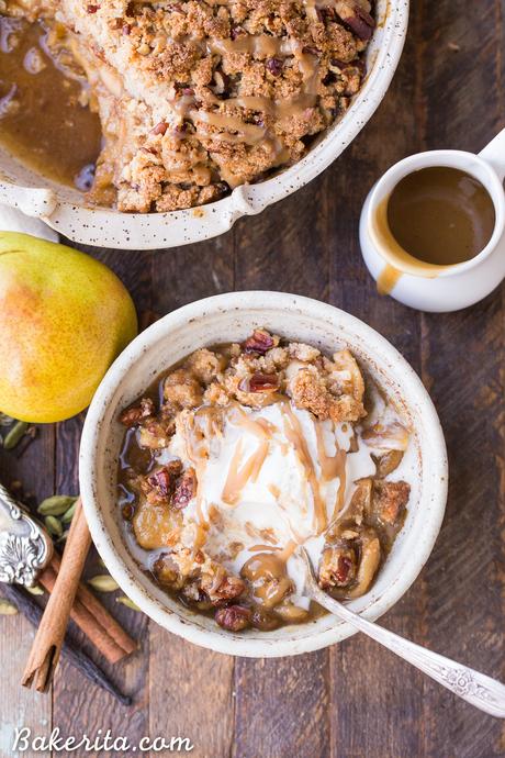 This Caramel Pear Crisp is a decadent and deliciously spiced dessert that's perfect for the holidays. The caramel pear filling is spiced with cinnamon, cardamom, cloves, and vanilla bean, and topped with a crunchy almond flour and pecan crisp topping. Don't forget to serve this gluten-free, paleo, and vegan crisp with some whipped coconut cream!