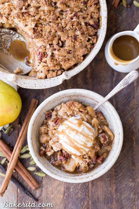 This Caramel Pear Crisp is a decadent and deliciously spiced dessert that's perfect for the holidays. The caramel pear filling is spiced with cinnamon, cardamom, cloves, and vanilla bean, and topped with a crunchy almond flour and pecan crisp topping. Don't forget to serve this gluten-free, paleo, and vegan crisp with some whipped coconut cream!