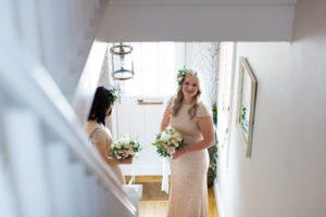 bridesmaids at bottom of the stairs