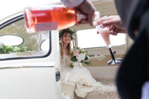 Villa farm wedding photography Bride watches pink champagne poured