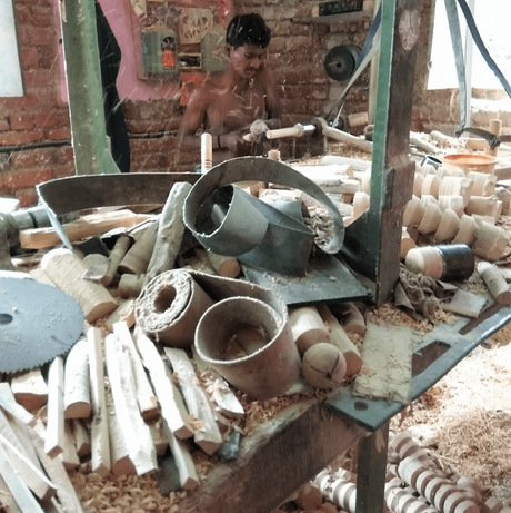 A toy worker on a lathe machine