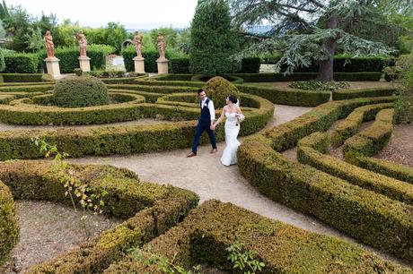 Villa Catignano Siena Wedding Photography couple walks through hedge maze