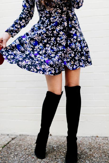 Amy Havins wears a blue floral print Shoshanna dress with Stuart Weitzman over the knee boots.