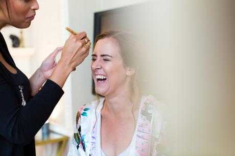 York Wedding Photographers bride laughing during makeup