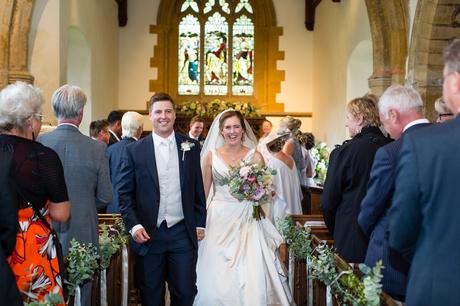 York Wedding photographers walking up aisle