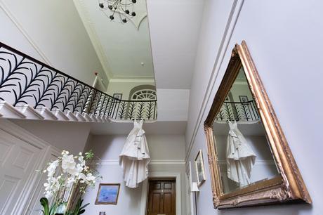 York Wedding Photographers Ian Stuart Dress hanging from stairs