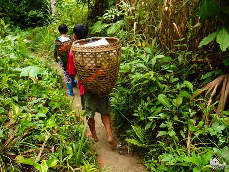 Locals carrying their produce