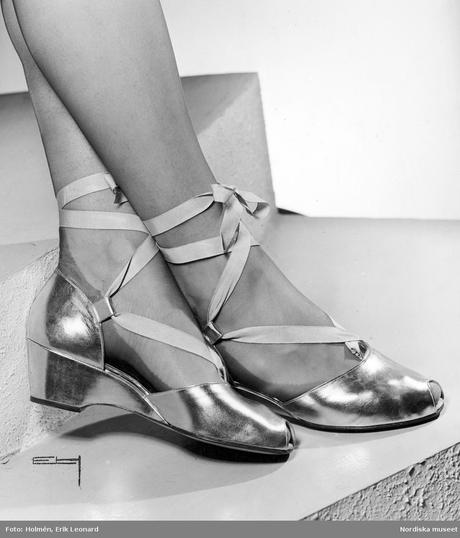 Evening shoes in gold and silver with ribbon band attached along the ankle 1944 Evening shoes in gold and silver with ribbon band attached along the ankle 1944