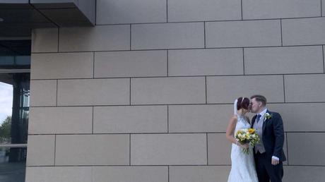 The Bride and groom have a kiss outside media city after being married