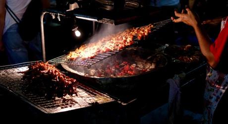 Southeast Asian street food: Grilled meat at a night market in Vietnam