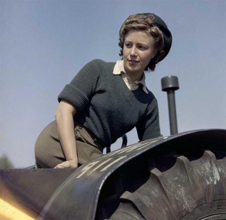 Doreen-Bacchus,-a-Land-Army-girl,-on-a-tractor Land Girl Doreen Bacchus operates a tractor