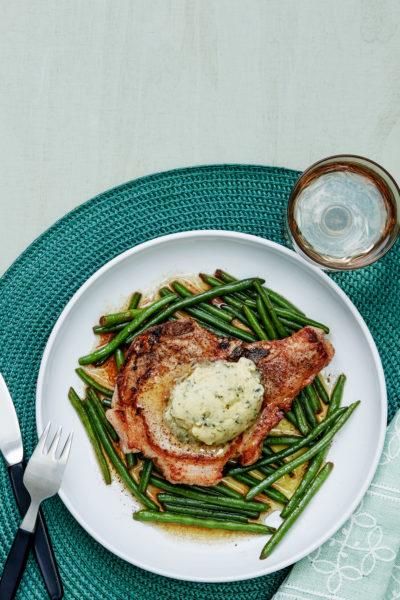 Pork chops with green beans and garlic butter