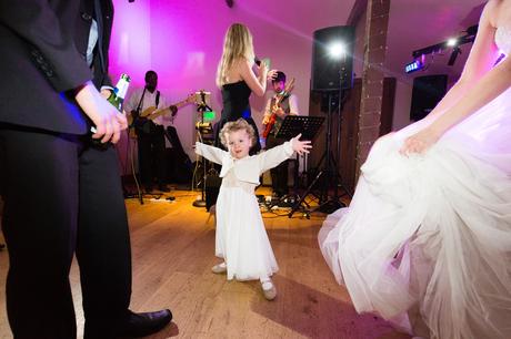 Little girl on the dance floor at wedding