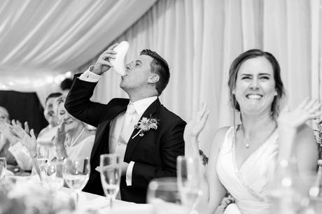 Groom drinking out of cricket box and bride makes funny face york wedding photography