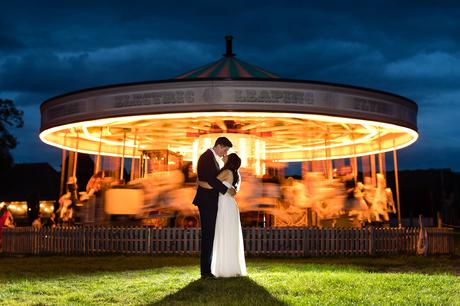 York wedding photography bride and groom in front of moving carousel