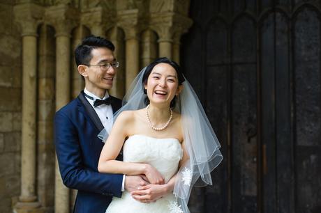 Couple laugh outside of church wedding in york