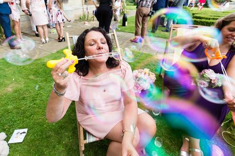 Wedding photography in york guest blows big bubbles
