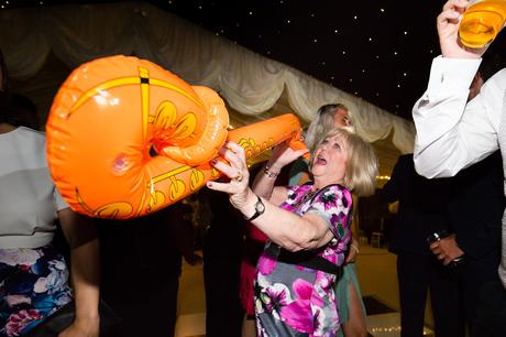 Guest playing blow up saxophone for york wedding