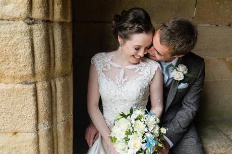 Couple kiss and cuddle at york wedding 