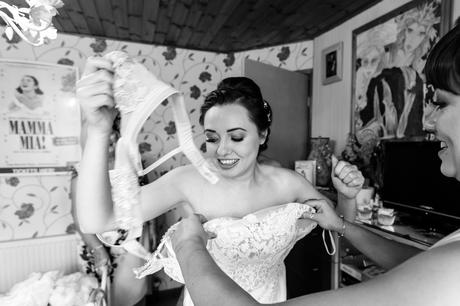 York wedding photography documentary bride getting into wedding dress