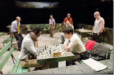 (Center) Cash (Cedric Mays) and Rey Reyes (Raúl Castillo) face off in front of avid chess hustlers in Teatro Vista’s Fish Men, written by Cándido Tirado and presented by Goodman Theatre (April 7 – May 6).